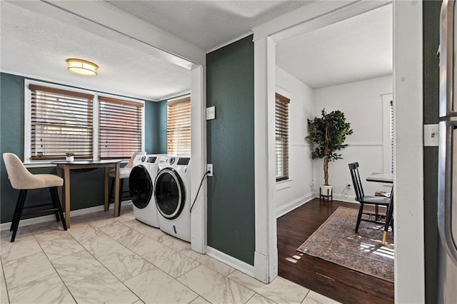 washroom featuring washing machine and clothes dryer