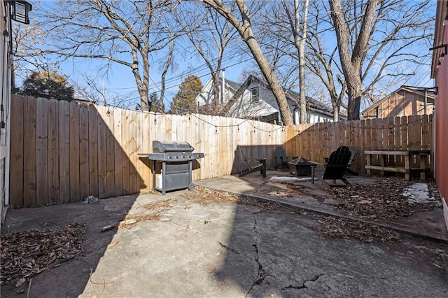 view of yard with an outdoor fire pit and a patio area