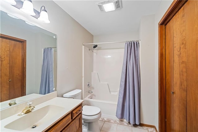 bathroom featuring toilet, shower / tub combo, vanity, visible vents, and tile patterned floors