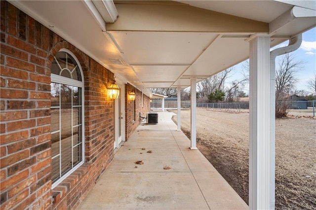 view of patio / terrace with cooling unit and fence