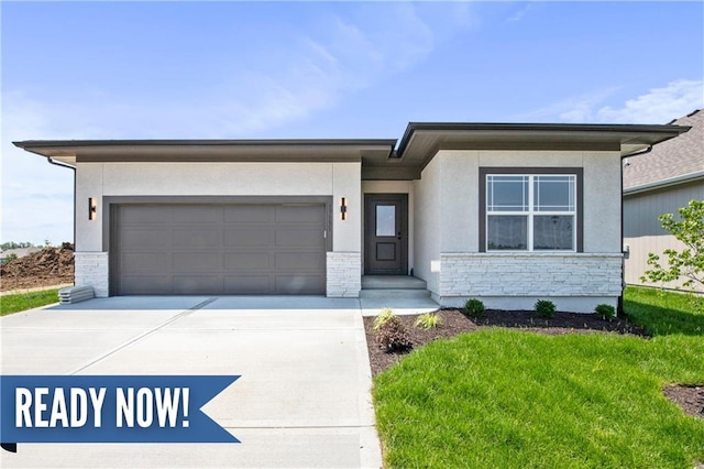 17151 W 168th Pl, Olathe, KS 66062 - prairie-style home with driveway, an attached garage, stucco siding, a front yard, and stone siding