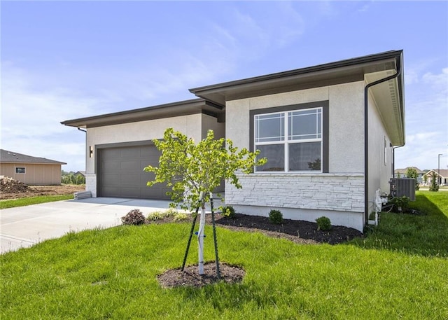 17151 W 168th Pl, Olathe, KS 66062 - view of front of property featuring concrete driveway, an attached garage, stucco siding, and stone siding