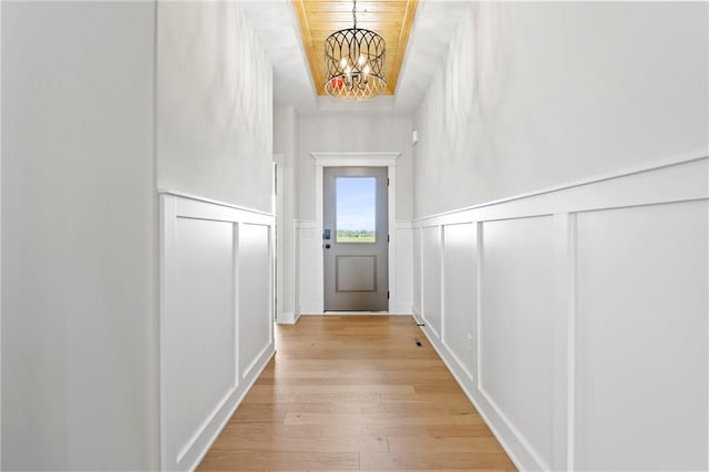 17151 W 168th Pl, Olathe, KS 66062 - entryway with a decorative wall, a chandelier, wood finished floors, and a wainscoted wall