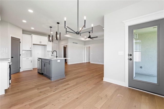 17151 W 168th Pl, Olathe, KS 66062 - kitchen featuring open floor plan, light wood finished floors, a chandelier, light countertops, and recessed lighting