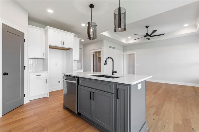 17151 W 168th Pl, Olathe, KS 66062 - kitchen featuring dishwasher, a ceiling fan, white cabinetry, a raised ceiling, and gray cabinets