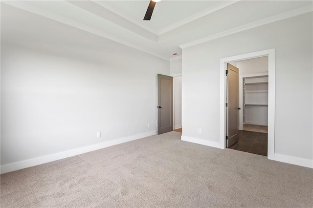 17151 W 168th Pl, Olathe, KS 66062 - unfurnished bedroom featuring carpet, crown molding, a walk in closet, ceiling fan, and a closet