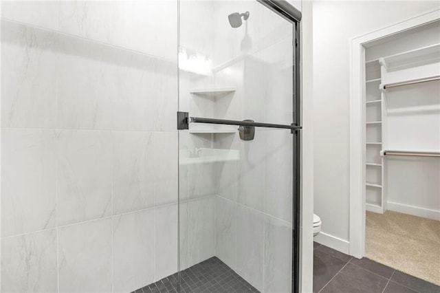 17151 W 168th Pl, Olathe, KS 66062 - bathroom featuring a stall shower, a spacious closet, and tile patterned flooring