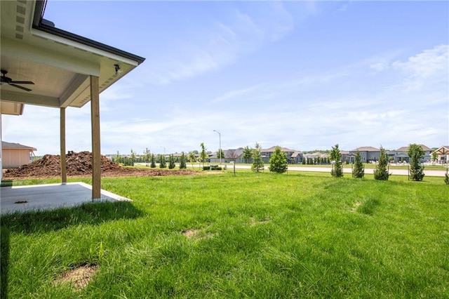 17151 W 168th Pl, Olathe, KS 66062 - view of grassy yard featuring a ceiling fan and a residential view