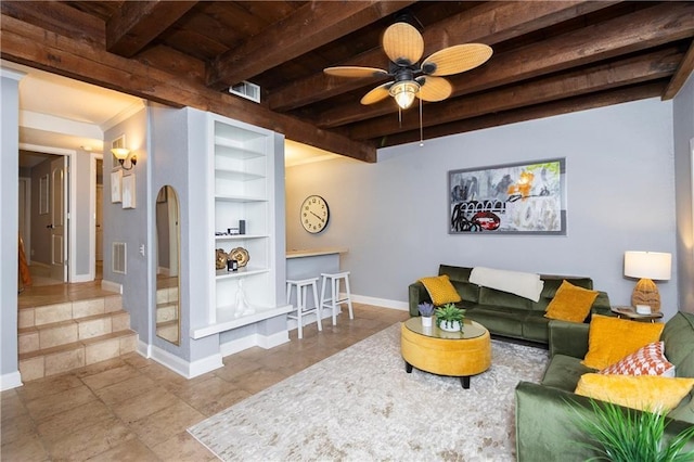 living room featuring crown molding, beamed ceiling, built in shelves, and ceiling fan