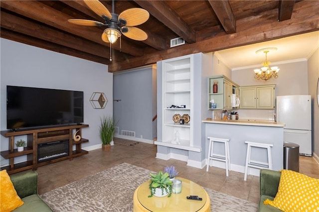 tiled living room featuring ornamental molding, wooden ceiling, built in features, beamed ceiling, and ceiling fan with notable chandelier