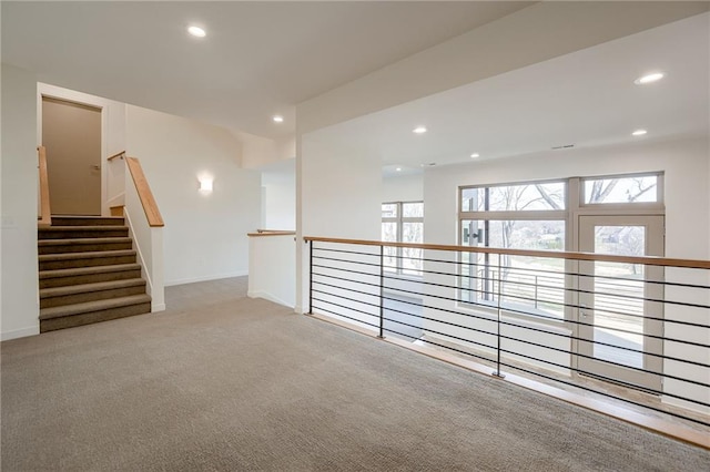 unfurnished room with carpet flooring, recessed lighting, and baseboards