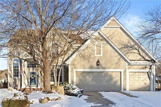 view of front of property with a garage and stucco siding