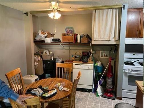 kitchen with ceiling fan and white appliances