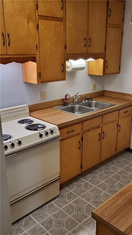 kitchen with sink and electric stove