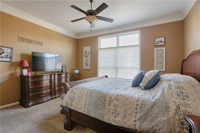 bedroom with carpet, crown molding, and ceiling fan