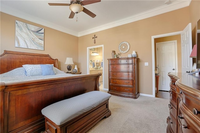 bedroom with ceiling fan, crown molding, light colored carpet, and ensuite bathroom