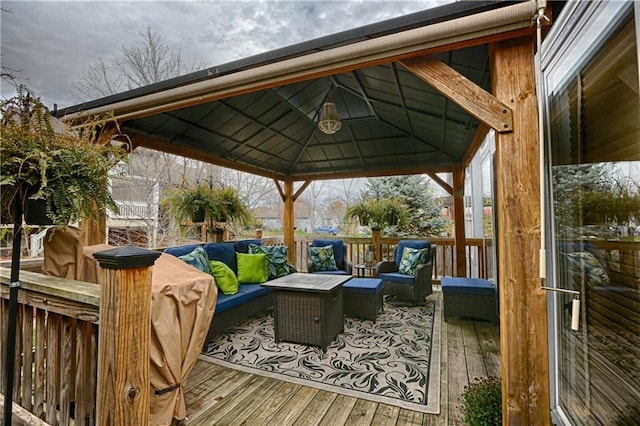 wooden terrace with an outdoor hangout area and a gazebo