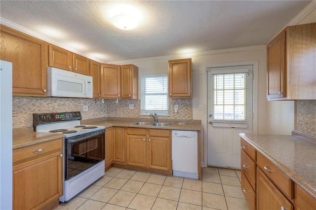 kitchen with light tile patterned floors, a textured ceiling, white appliances, a sink, and tasteful backsplash