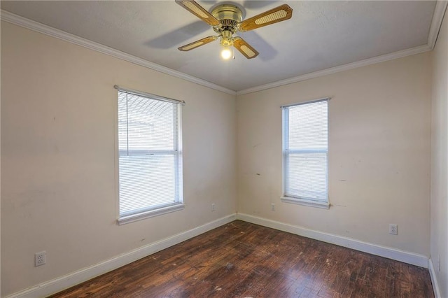 unfurnished room featuring ornamental molding, dark wood finished floors, and a wealth of natural light