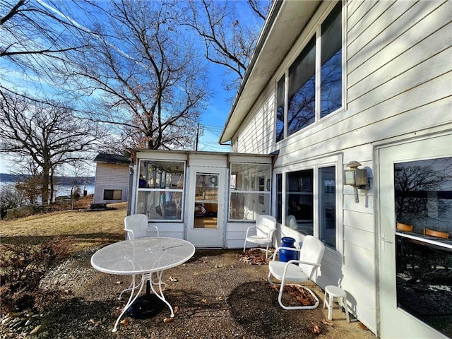 exterior space featuring a sunroom