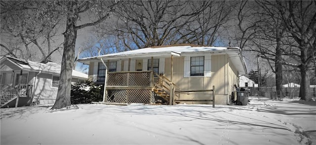 view of front of house with covered porch and stairway