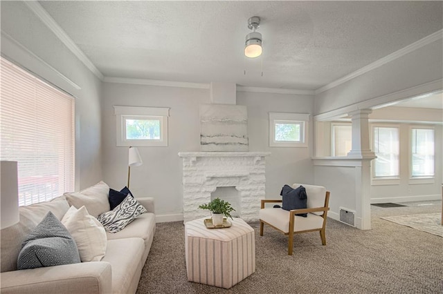 carpeted living room featuring plenty of natural light, a fireplace, and ornamental molding