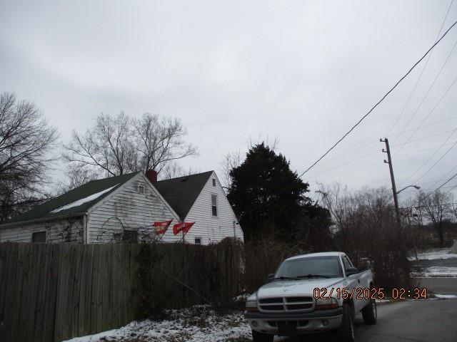 view of side of property with fence