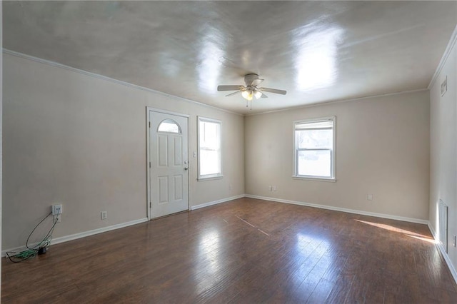 entryway featuring ornamental molding, ceiling fan, wood finished floors, and a healthy amount of sunlight