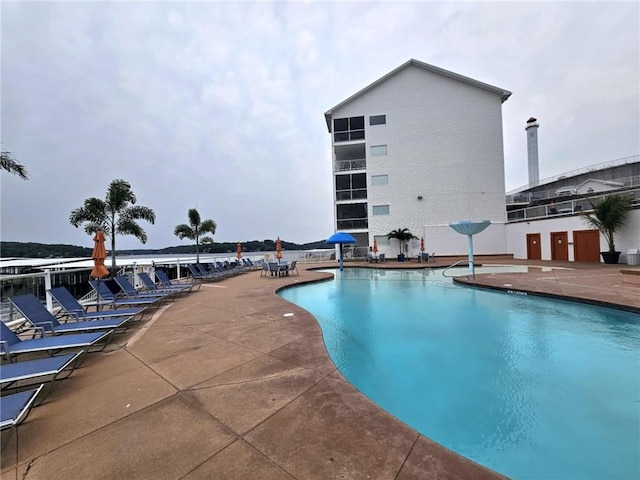 community pool featuring a patio