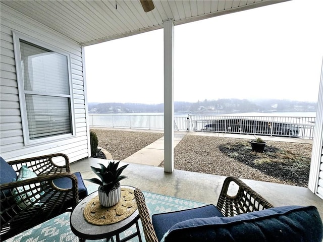 view of patio featuring a water view