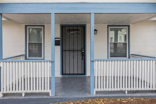 doorway to property featuring covered porch