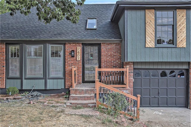 view of front of house featuring a garage, a shingled roof, concrete driveway, and brick siding