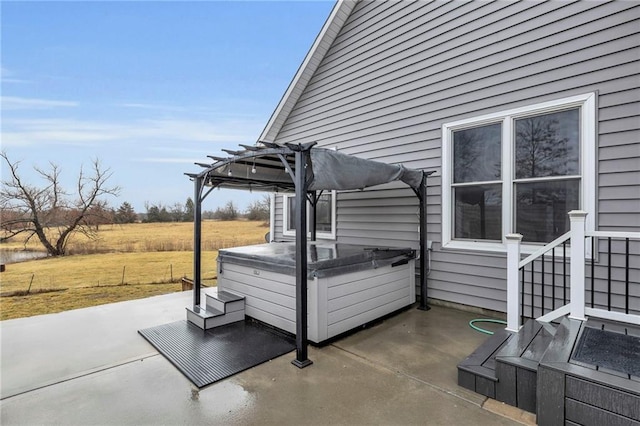 view of patio featuring a pergola and a hot tub