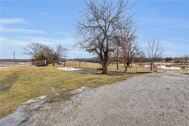 view of yard featuring volleyball court and a rural view