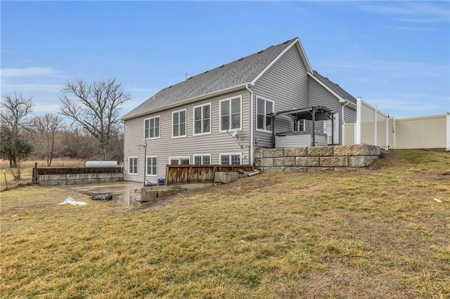 back of house with a yard, a patio area, and fence