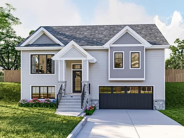 view of front of home with a front lawn and a garage