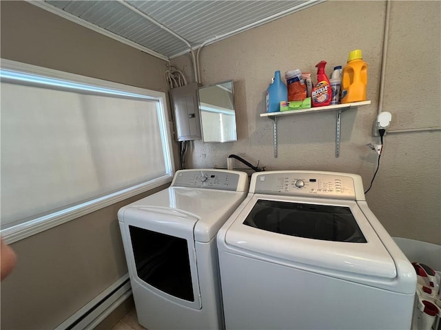 laundry area with a baseboard radiator, laundry area, electric panel, and separate washer and dryer