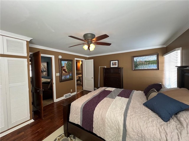 bedroom with baseboards, visible vents, a ceiling fan, ornamental molding, and wood finished floors