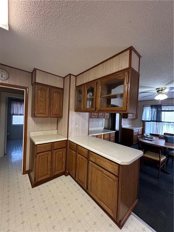 kitchen featuring a healthy amount of sunlight, light floors, and light countertops