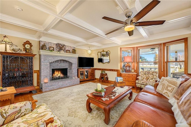 living room featuring beamed ceiling, a brick fireplace, coffered ceiling, and wood finished floors