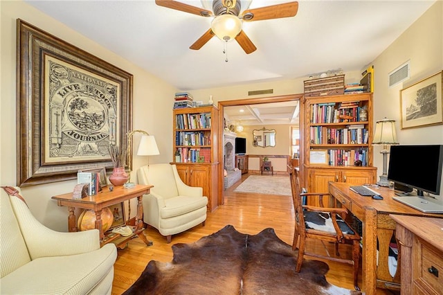 office with visible vents, ceiling fan, and wood finished floors