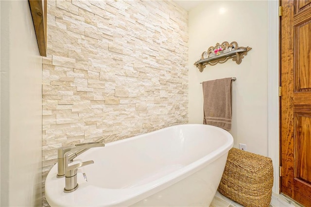 bathroom featuring a freestanding tub