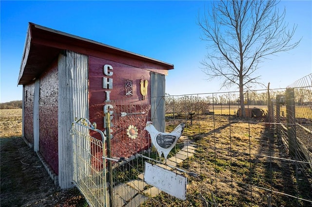 view of outbuilding with an outbuilding and fence