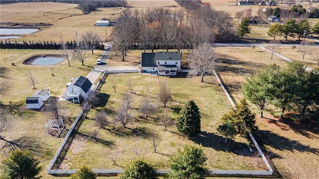 drone / aerial view featuring a rural view and a water view