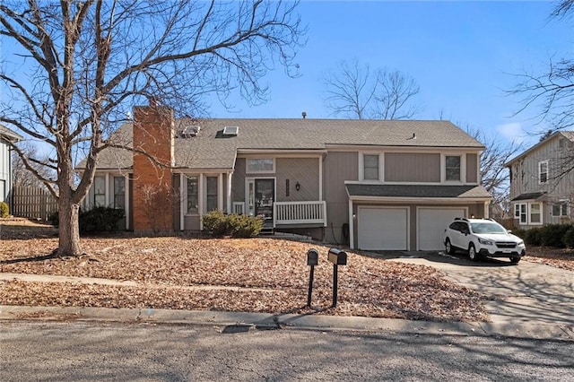 view of front of house featuring a garage, concrete driveway, a porch, and a chimney