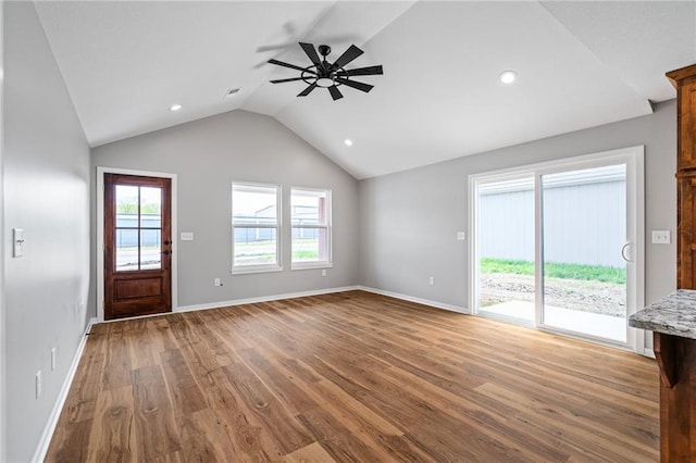 607 W Dryden St, Odessa, MO 64076 - unfurnished living room with baseboards, ceiling fan, recessed lighting, wood finished floors, and lofted ceiling