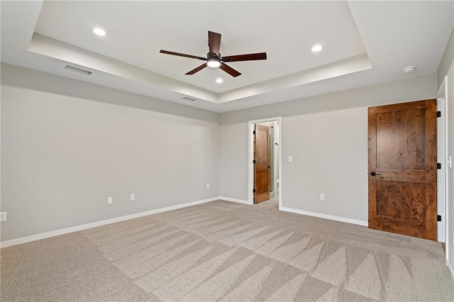 607 W Dryden St, Odessa, MO 64076 - unfurnished room with baseboards, recessed lighting, a ceiling fan, carpet floors, and a raised ceiling