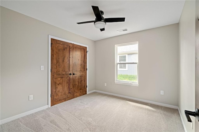 607 W Dryden St, Odessa, MO 64076 - unfurnished bedroom with visible vents, baseboards, a ceiling fan, and carpet flooring