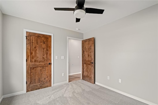 607 W Dryden St, Odessa, MO 64076 - unfurnished bedroom featuring ceiling fan, carpet flooring, and baseboards