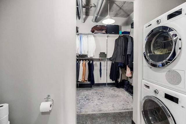 washroom with laundry area and stacked washing maching and dryer